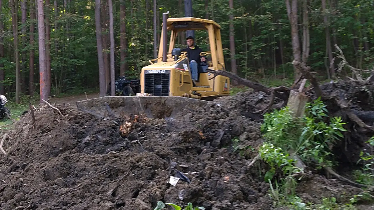 Tim the owner on Bulldozer clearing land